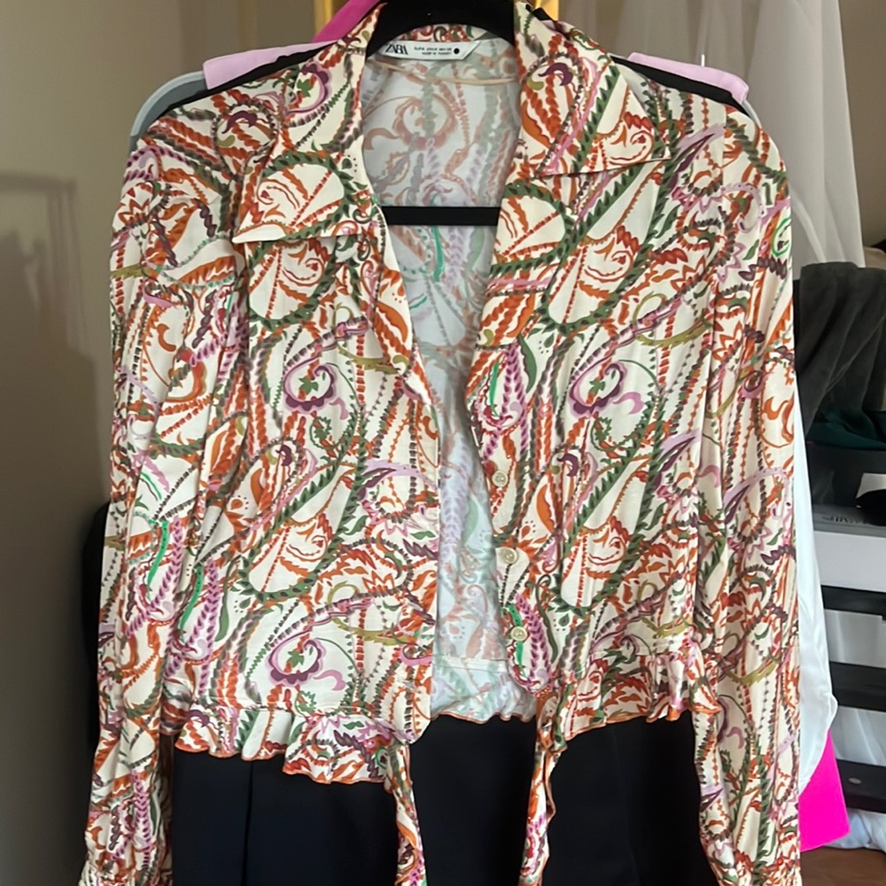 Light in material summer Zara blouse in a small. Great for the office or jeans.